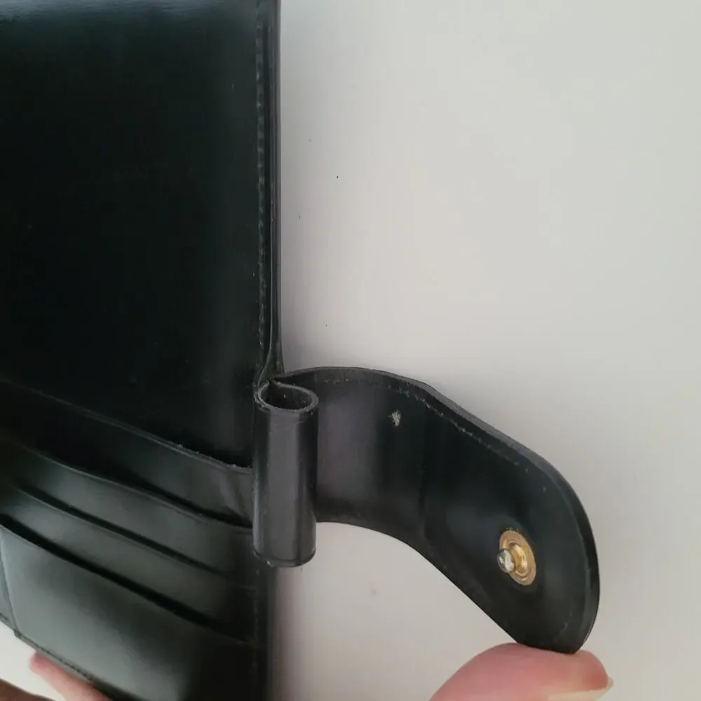 Cartier Black Leather Planner with Gold Panther Accent